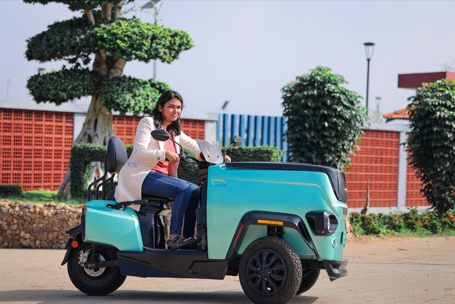 A woman driving CROC EV