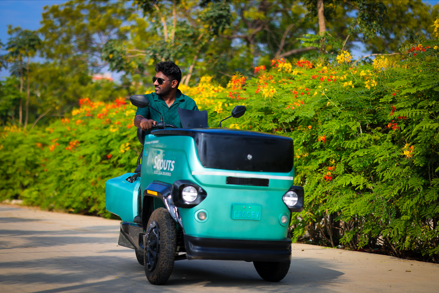 A man driving CROC EV