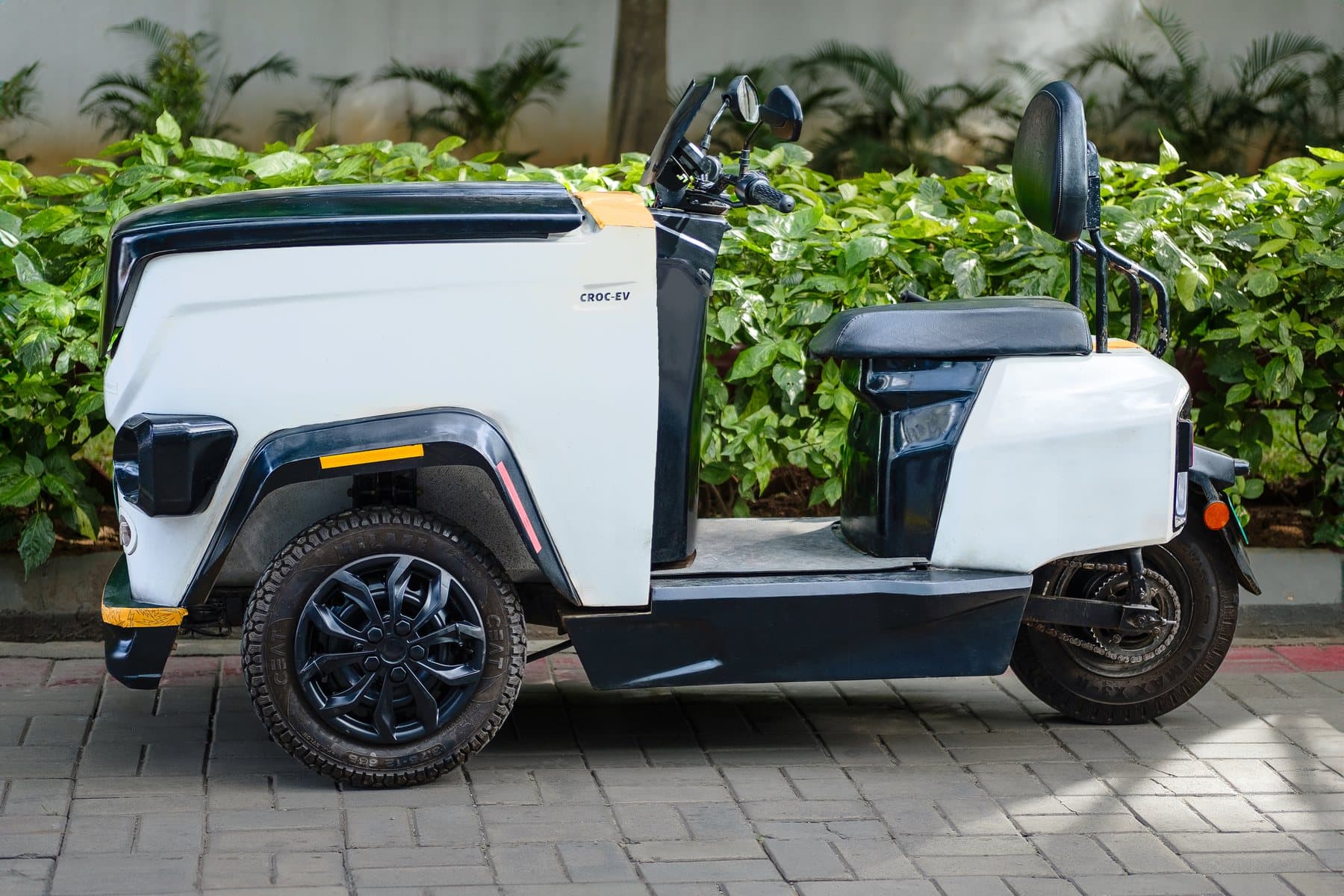 A white CROC EV from the side